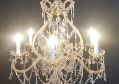 Lustre baroque artisanal en fer forgé patiné or